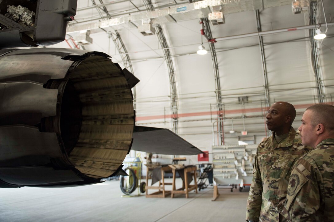 Chief Master Sgt. of the Air Force Kaleth O. Wright discusses the F-16 Fighting Falcon engine with a 455th Expeditionary Aircraft Maintenance Squadron Airman during a visit to Bagram Airfield, Afghanistan, Dec. 25, 2018. Wright spent much of the day touring facilities and gaining insight into the base’s current mission sets. (U.S. Air Force photo by Senior Airman Kaylee Dubois)