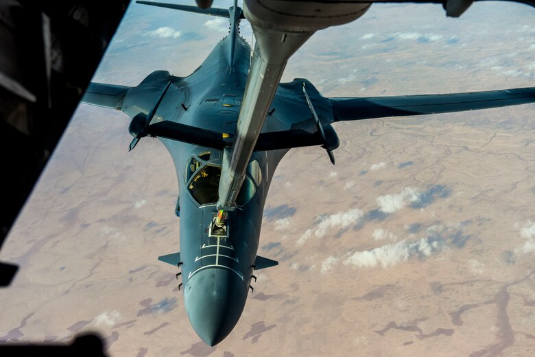A B1-B Lancer refuels in flight from a 908th Expeditionary Refueling Squadron KC-10 Extender over Southwest Asia, Dec. 19, 2018.