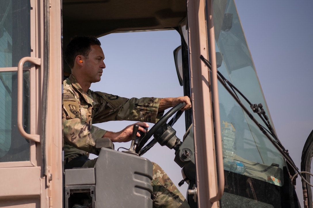 Airmen Forklifting Pallet