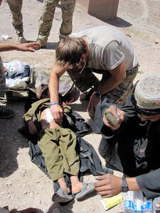 A young Afghan boy was injured by shrapnel in his village. Sgt. 1st Class Philip Nordstrom treated the boy after he was injured.