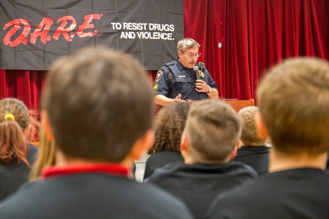Cpl. Chris Stephens speaks to students at the graduation of the Drug Abuse Resistance Education program at Laurel Bay, Dec. 17. The goal of the program is the educate students
on the danger of substance abuse. Stephens is the school resource officer for Laurel Bay schools. (U.S. Marine Corps photo by Cpl. Debra S. Sainer/Released)