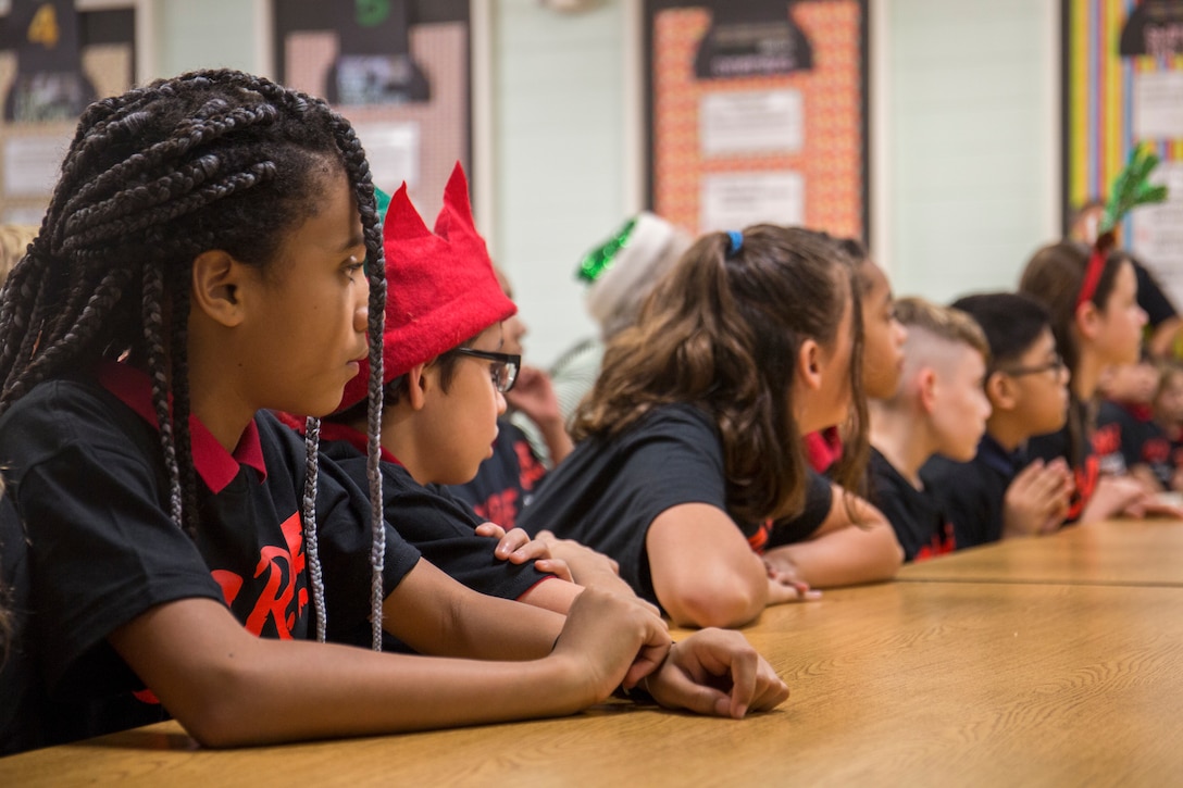 Students with Charles F. Bolden Elementary School graduate the D.A.R.E. program, Dec. 17, 2018. D.A.R.E is a ten week course that teaches students about the harmful effects of drugs and violence. (U.S. Marine Corps photo by Cpl. Debra S. Sainer/Released)