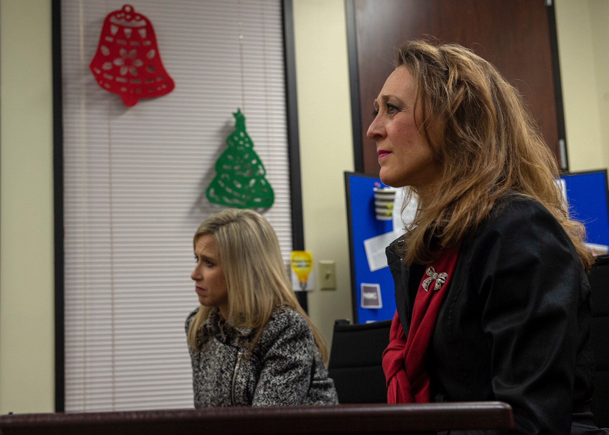 Joni Kwast, wife of U.S. Air Force Lt. Gen. Steven Kwast, commander of Air Education and Training Command, sits beside Tammy Carney, wife of Col. Eric Carney, 97th Air Mobility Wing commander, during an Airman and Family Readiness Center briefing, Dec. 18, 2018, at Altus Air Force Base, Okla. Kwast and Carney toured several locations on base that support the families of the Airmen. Kwast and her husband toured the base to learn more about how AETC can support Altus in future operations. (U.S. Air Force Photo by Senior Airman Jackson N. Haddon)