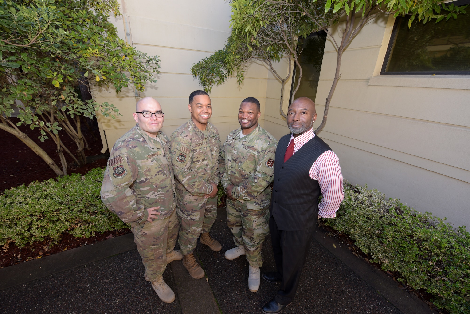 From left to right, U.S. Air Force Staff Sgt. Erick Hernandez, 60th Air Mobility Wing Equal Opportunity counselor, Air Force Staff Sgt. Baso Harper III, 60th AMW EO counselor, Air Force Tech. Sgt. Piankhy Richberg, 60th AMW EO NCO in charge and Grayland Hilt, 60th AMW EO director, pose for a photo Dec. 17, 2018, at Travis Air Force Base, California.. The EO office implemented a new conflict management program in June 2018 to help Airmen resolve conflict. (U.S. Air Force photo by Tech. Sgt. James Hodgman)