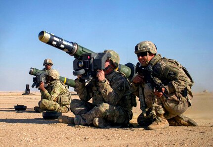 Army Pvt. Hayden Johnson, center, a cavalry scout with the Mississippi Army National Guard's Troop B, 1st Squadron, 98th Cavalry Regiment, aims an FGM-148 Javelin anti-tank missile during a combined arms live fire exercise as part of Desert Observer II at the Udairi Range Complex near Camp Buehring, Kuwait, Dec. 12, 2018. The year kept National Guard members busy as they took part in joint and multi-national training exercises and deployed overseas as part of contingency operations.