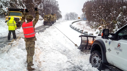 Soldiers with the North Carolina Army National Guard's 690th Brigade Support Battalion assist North Carolina Department of Transportation personnel with recovering snow plows and assisting stuck drivers during a winter storm, Dec. 9, 2018. The year kept National Guard members busy at home responding to snowstorms, wildfires and hurricanes. Guard members also took part in joint and multi-national training exercises, deployed overseas as part of contingency operations and celebrated milestones, such as the 25th anniversary of the Department of Defense's State Partnership Program, which pairs Guard elements with partner nations worldwide.