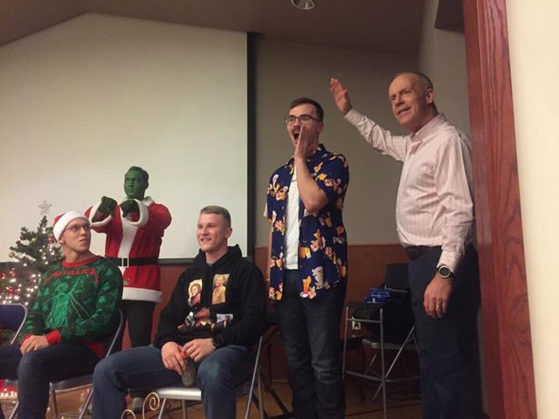 CAMP HUMPHREYS, Republic of Korea – Maj. Gen. Patrick J. Hermesmann, commander of U.S. Marine Corps Forces Korea, judges the “Ugly Sweater” Competition during the MARFORK Holiday Party here, Dec. 21.  Marines and families used the Pacific Victors Chapel for the holiday party to celebrate the command’s accomplishments, strengthen relationships within the command, and share their common fellowship with each other.