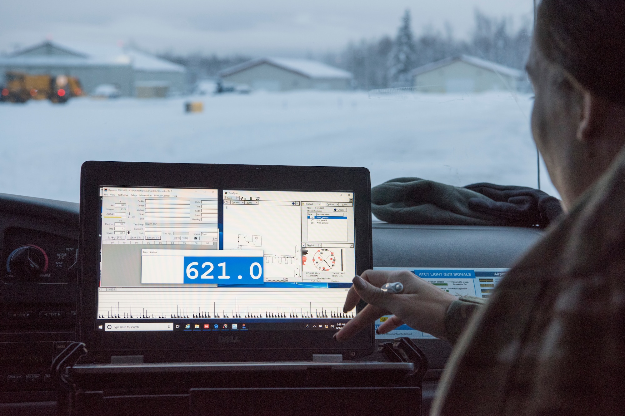 U.S. Air Force Master Sgt. Jill Reed, Air Force Civil Engineer Center’s Airfield Pavement Evaluation Team superintendent, uses Geographical information surveying software to test the structural capacity of the pavement during an evaluation of Bryant Army Airfield at Joint Base Elmendorf-Richardson, Alaska Dec. 17, 2018. A two-person team used non-destructive testing to assess potential non-visible pavement damage at all of JBER’s airfields following the Nov. 30, 7.0 magnitude earthquake, whose epicenter was located just north of the base. The deflectometer simulates 55,000 pounds of weight hitting the pavement at once. (U.S. Air Force photo by Airman 1st Class Crystal A. Jenkins)