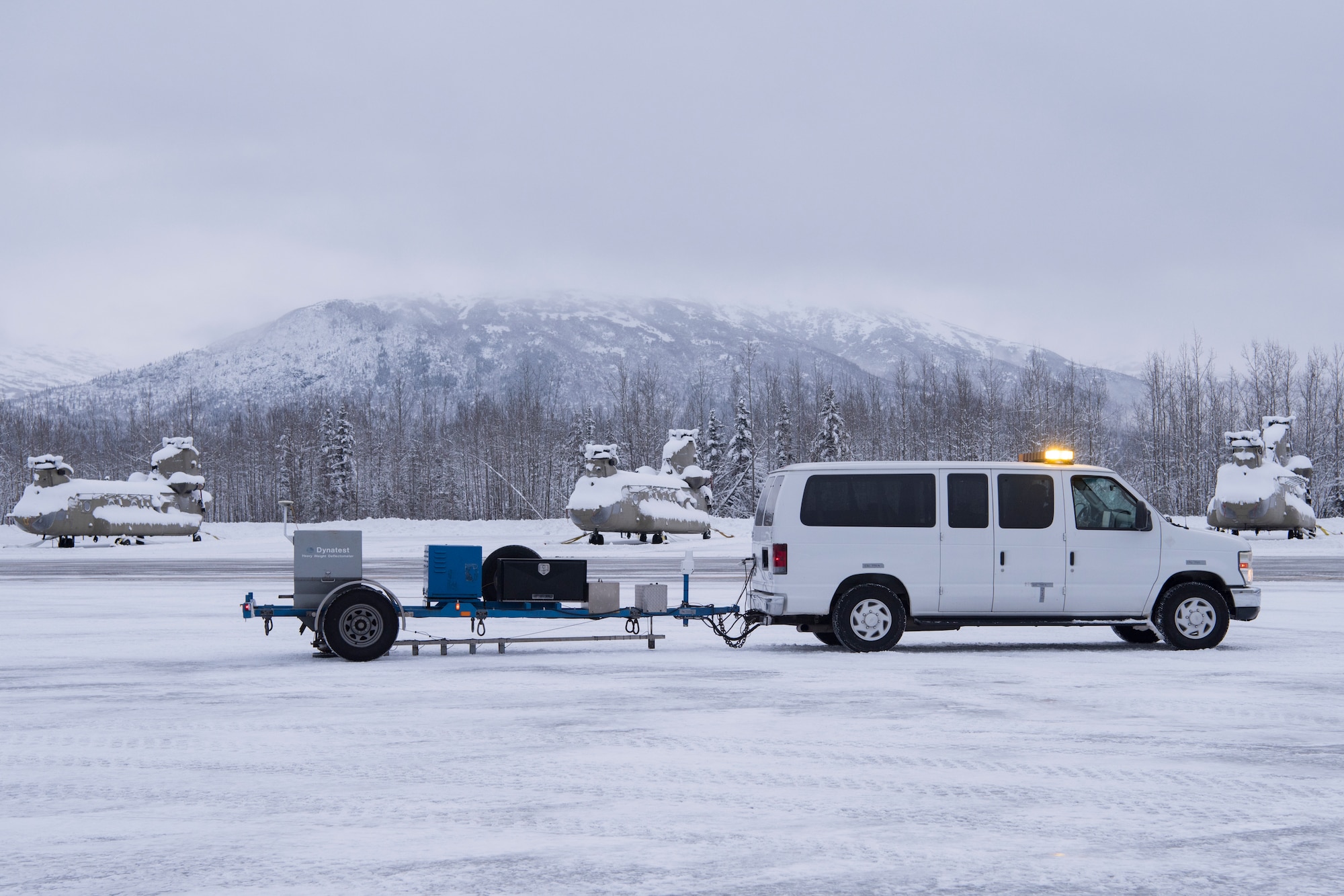 An Air Force Civil Engineer Center’s Airfield Pavement Evaluation Team uses a special heavy falling weight Dynatest deflectometer during an evaluation of Bryant Army Airfield at Joint Base Elmendorf-Richardson, Alaska Dec. 17, 2018. The two-person team used non-destructive testing to assess potential non-visible pavement damage at all of JBER’s airfields following the Nov. 30, 7.0 magnitude earthquake, whose epicenter was located just north of the base. The deflectometer simulates 55,000 pounds of weight hitting the pavement at once. (U.S. Air Force photo by Airman 1st Class Crystal A. Jenkins)