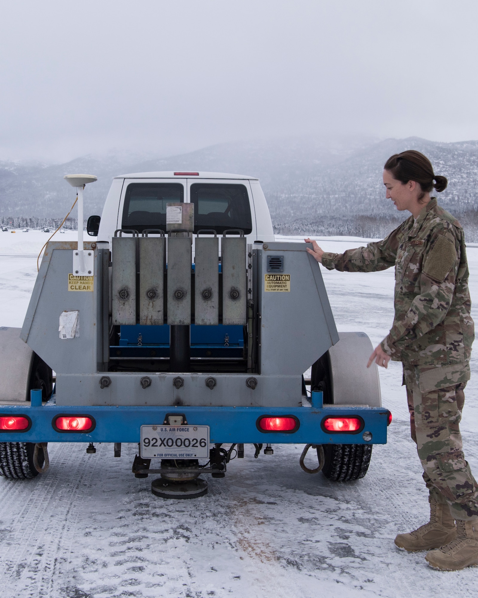 U.S. Air Force Master Sgt. Jill Reed, Air Force Civil Engineer Center’s Airfield Pavement Evaluation Team superintendent, checks a special heavy falling weight Dynatest deflectometer, during an evaluation of Bryant Army Airfield at Joint Base Elmendorf-Richardson, Alaska Dec. 17, 2018.  A two-person team used non-destructive testing to assess potential non-visible pavement damage at all of JBER’s airfields following the Nov. 30, 7.0 magnitude earthquake, whose epicenter was located just north of the base. The deflectometer simulates 55,000 pounds of weight hitting the pavement at once. (U.S. Air Force photo by Airman 1st Class Crystal A. Jenkins)