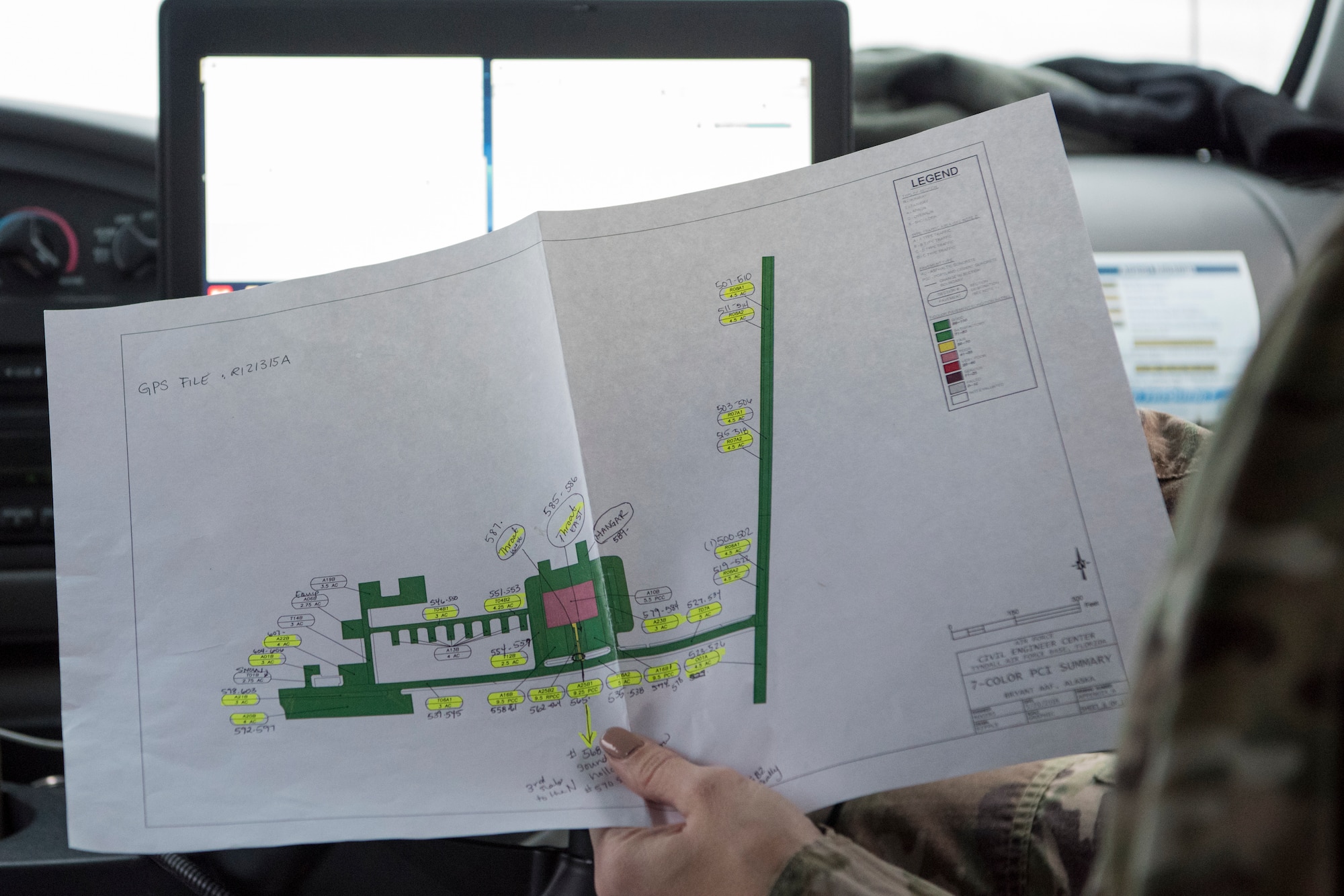 U.S. Air Force Master Sgt. Jill Reed, Air Force Civil Engineer Center’s Airfield Pavement Evaluation Team superintendent, holds a pavement section map during an evaluation of Bryant Army Airfield at Joint Base Elmendorf-Richardson, Alaska Dec. 17, 2018. A two-person team used non-destructive testing to assess potential non-visible pavement damage at all of JBER’s airfields following the Nov. 30, 7.0 magnitude earthquake, whose epicenter was located just north of the base. (U.S. Air Force photo by Airman 1st Class Crystal A. Jenkins)