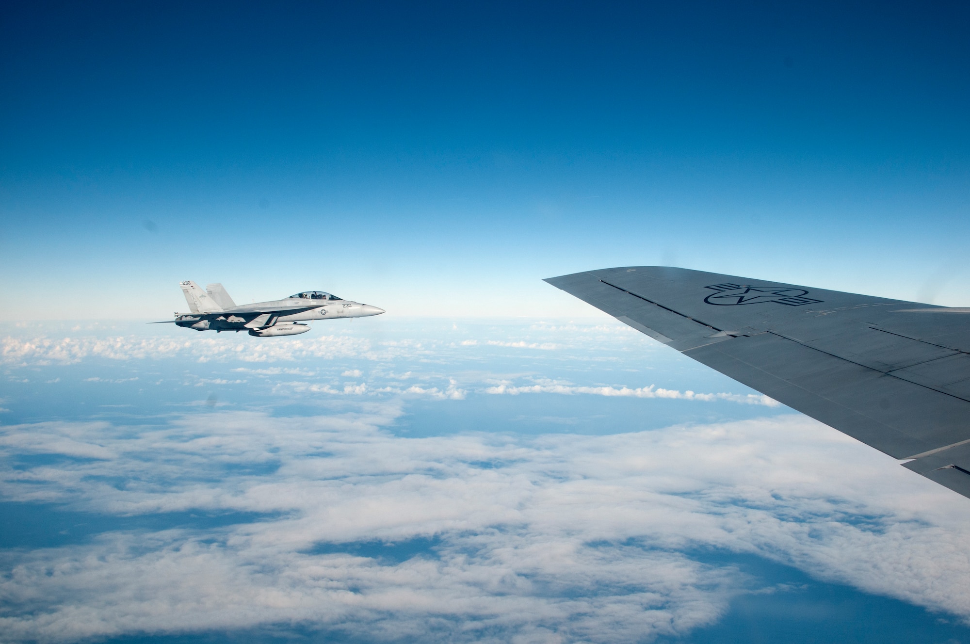 The 128th Air Refueling Squadron’s KC-135 Stratotanker prepares to refuel a Navy F/A-18 Hornet from China Lakes as part of a routine Sentry Aloha exercise, Dec. 12, 2018