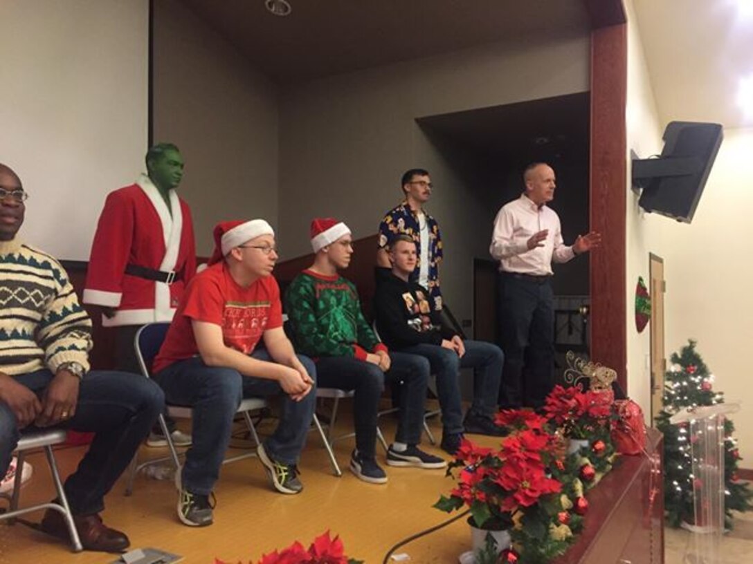 CAMP HUMPHREYS, Republic of Korea – Maj. Gen. Patrick J. Hermesmann, commander of U.S. Marine Corps Forces Korea, judges the “Ugly Sweater” Competition during the MARFORK Holiday Party here, Dec. 21.  Marines and families used the Pacific Victors Chapel for the holiday party to celebrate the command’s accomplishments, strengthen relationships within the command, and share their common fellowship with each other.