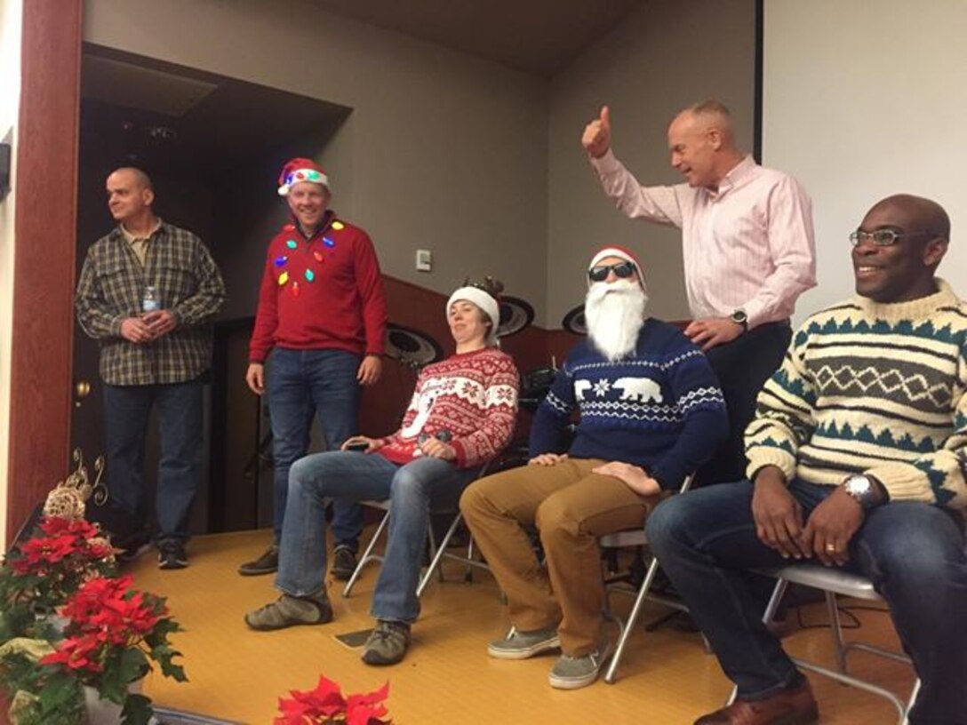 CAMP HUMPHREYS, Republic of Korea – Maj. Gen. Patrick J. Hermesmann, commander of U.S. Marine Corps Forces Korea, judges the “Ugly Sweater” Competition during the MARFORK Holiday Party here, Dec. 21.  Marines and families used the Pacific Victors Chapel for the holiday party to celebrate the command’s accomplishments, strengthen relationships within the command, and share their common fellowship with each other.