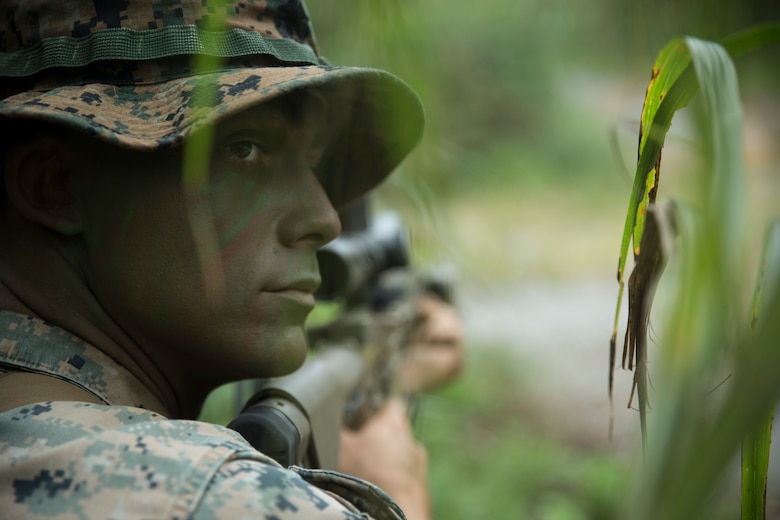 Cpl. Chancelor J. Kelso, a scout sniper team leader with Weapons Company, Battalion Landing Team, 1st Battalion, 4th Marines, posts security during reconnaissance and surveillance training at Camp Hansen, Okinawa, Japan, Dec. 12, 2018.