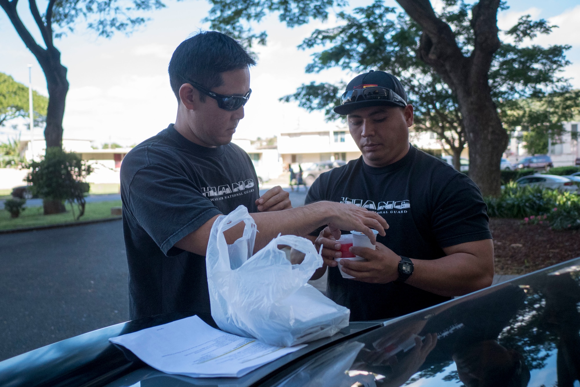 Staff Sgt. John Quijano, from the Hawaii Air National Guard’s 154th Logistics Squadron, deliver a meal to a disabled resident Dec. 17, 2018