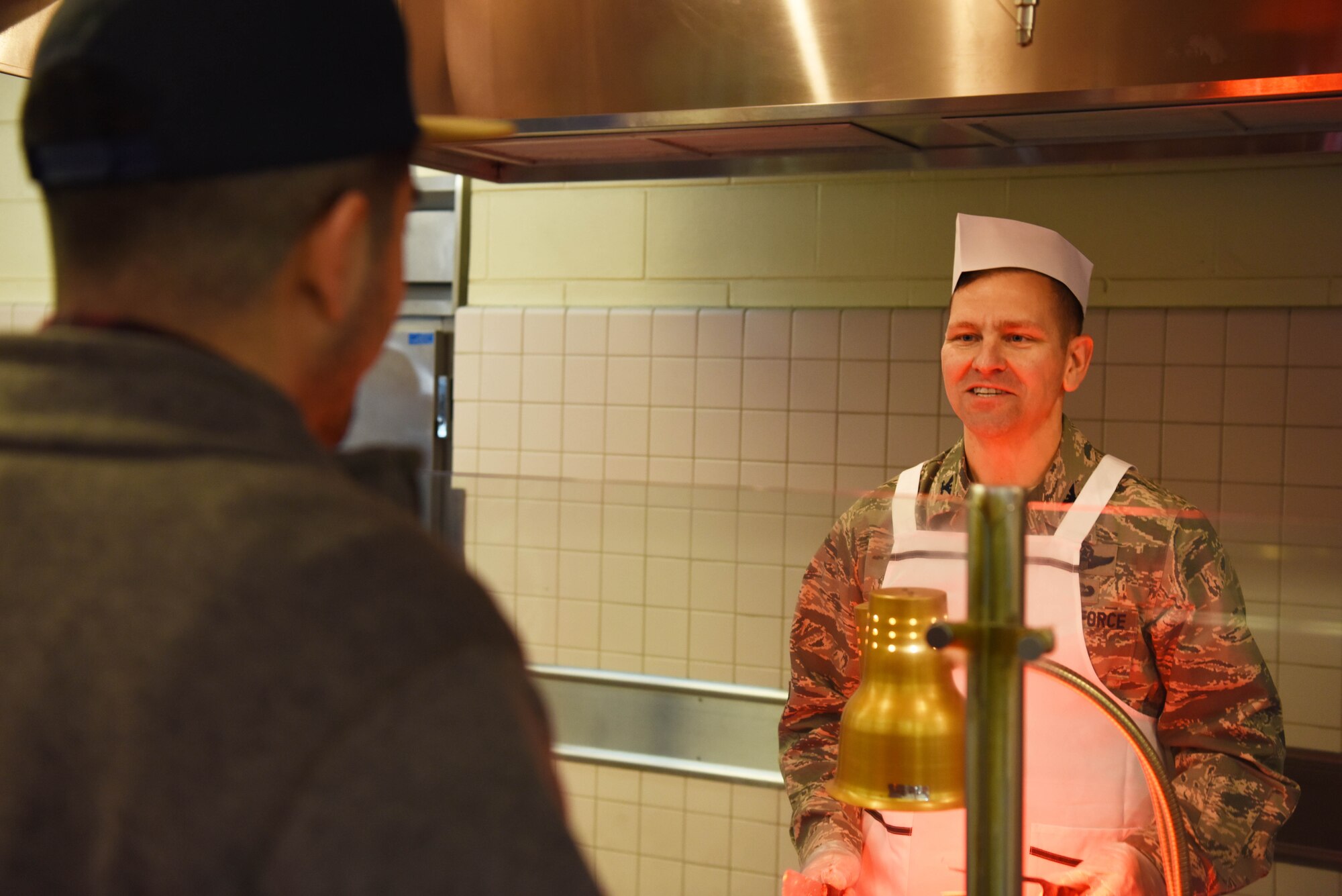 U.S. Air Force Col. Jon Wheeler, 8th Fighter Wing vice commander, takes an order during a holiday meal at Kunsan Air Base, Republic of Korea, Dec. 25, 2018. Leaders from the 8th Fighter Wing served meals to Airmen who spent the holiday away from home. (U.S. Air Force photo by Staff Sgt. Joshua Edwards)