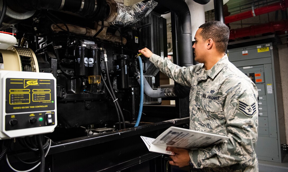 U.S. Air Force Staff Sgt. Bryson Ott, 8th Civil Engineer Squadron generator systems non-comissioned officer in charge, checks the poil level on a diesel generator at Kunsan Air Base, Republic of Korea, Dec. 20, 2018. Critical resources such as medical and security forces are equipped with emergency power systems that can provide their facilities with power for several days before refueling. (U.S. Air Force photo by Senior Airman Stefan Alvarez)