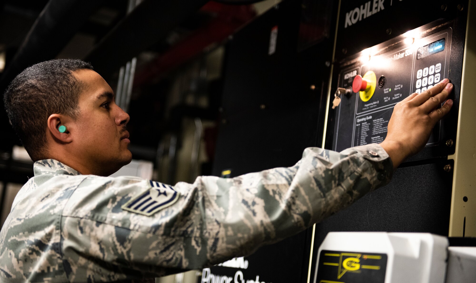 U.S. Air Force Staff Sgt. Bryson Ott, 8th Civil Engineer Squadron generator systems non-comissioned officer in charge, checks the data readings of a diesel generator at Kunsan Air Base, Republic of Korea, Dec. 20, 2018. Several facilities are equipped with emergency power systems to keep their operations going in austere conditions. (U.S. Air Force photo by Senior Airman Stefan Alvarez)