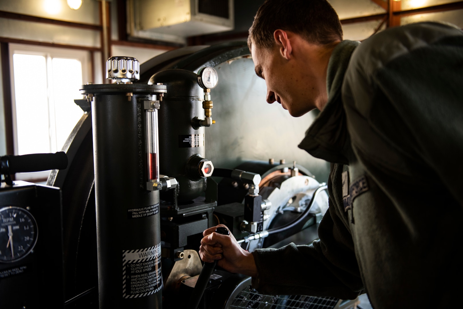 U.S. Air Force Airman 1st Class Zane Mammon, 8th Civil Engineer Squadron electical power production specalist, performs a routine check on a barrier arresting kit at Kunsan Air Base, Republic of Korea, Dec. 19, 2018. Flightlines across the Air Force have several aircraft arresting systems to assist fighters in the event on an in-flight emergency. (U.S. Air Force photo by Senior Airman Stefan Alvarez)