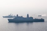INDIAN OCEAN (Dec. 26, 2018) The San Antonio-class amphibious transport dock ship USS Anchorage (LPD 23), bottom, transits the Bay of Bengal alongside Indian navy destroyer INS Rajput (D 51) while conducting a cooperative deployment with the Indian navy. Anchorage is deployed as part of the Essex Amphibious Ready Group (ARG) and 13th Marine Expeditionary Unit (MEU).