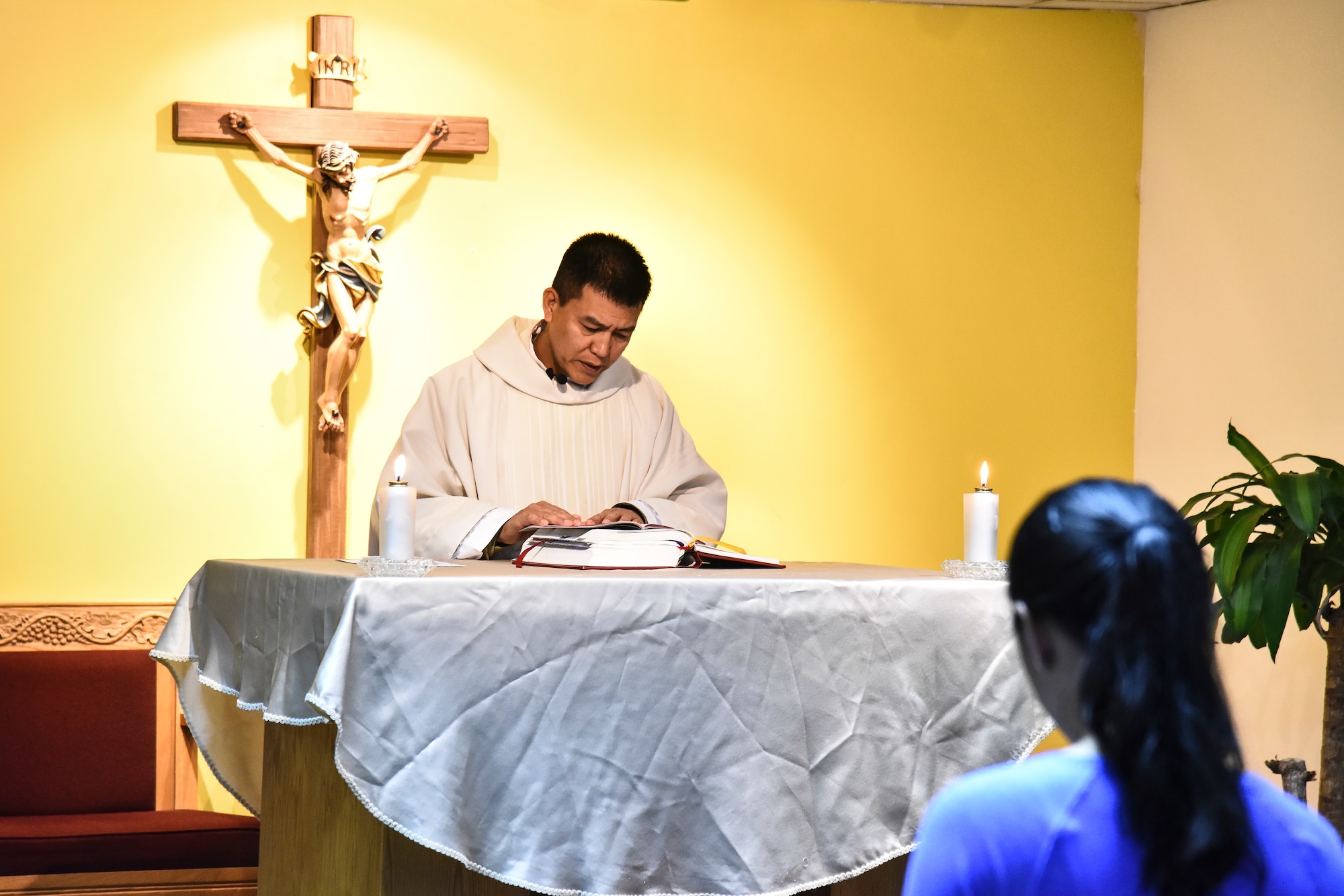 U.S. Air Force Chaplain Peter Vo conducts a religious service at Al Dhafra Air Base, United Arab Emirates, Dec. 25, 2018. The eight-member team is in charge of consulting with leadership on moral, ethical and quality-of-life issues; boosting the morale at ADAB by hosting and conducting regional trips and organizing events; providing resources for and conduct for worship services; and personally guiding any individual that knocks on their door. (U.S. Air Force photo by Senior Airman Mya M. Crosby)