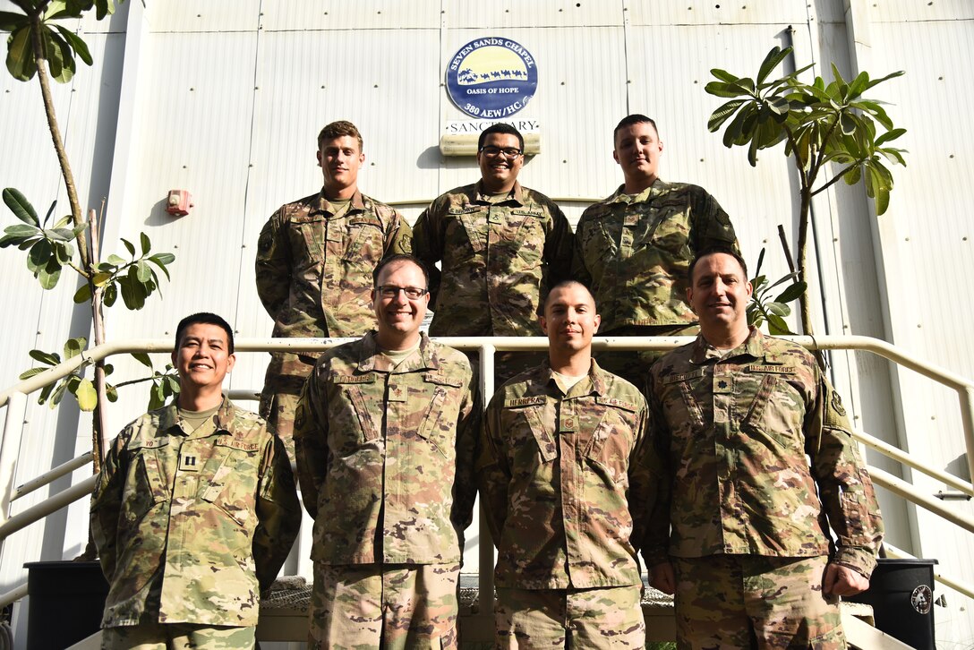 The U.S. Armed Forces Chapel Team poses for a photo at Al Dhafra Air Base, United Arab Emirates, Dec. 25, 2018. The team consists of six Airman from the 380th Air Expeditionary Wing religious support team and two Soldiers from the 1-43 Air Defense Artillery Battalion unit ministry. The eight-member team is in charge of consulting with leadership on moral, ethical and quality-of-life issues; boosting the morale at ADAB by hosting and conducting regional trips and organizing events; providing resources for and conduct for worship services; and personally guiding any individual that knocks on their door. (U.S. Air Force photo by Senior Airman Mya M. Crosby)