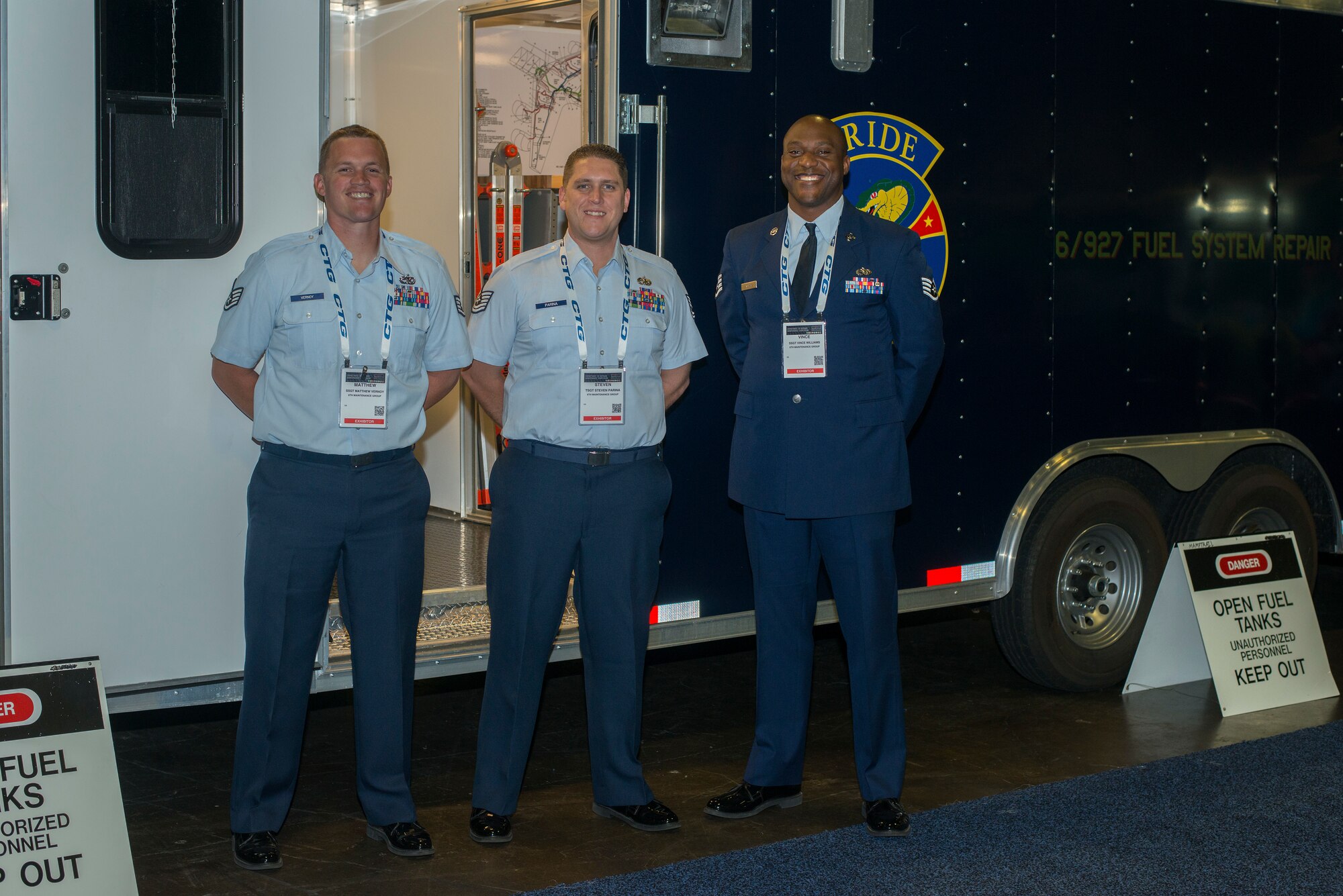 From left: U.S. Air Force Staff Sgt. Matthew Vernoy, 6th Aircraft Maintenance Squadron (6 AMX) fuel systems craftsman, Tech. Sgt. Steven Parina, 6th AMXS fuels NCOIC and Staff Sgt. Vince Williams, 927th Maintenance Group fuels mechanic, pause for a photo at the 2018 Department of Defense Maintenance Symposium, Tampa, Fla., Dec. 19, 2018.