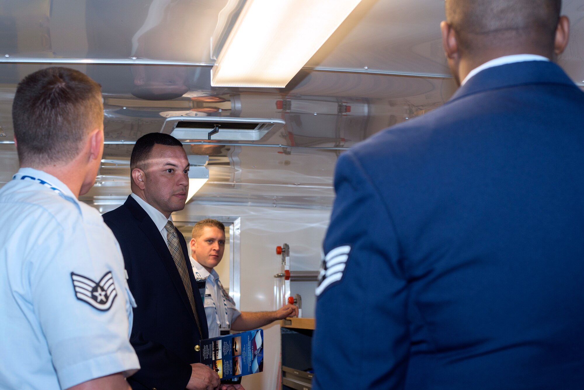 6th Maintenance Group (6 MXG) and 927th MXG maintainers from MacDill Air Force Base, Fla., speak with a visitor to the fuel system team’s mobile work trailer at the Tampa Convention Center, Tampa. Fla., Dec. 19, 2018.