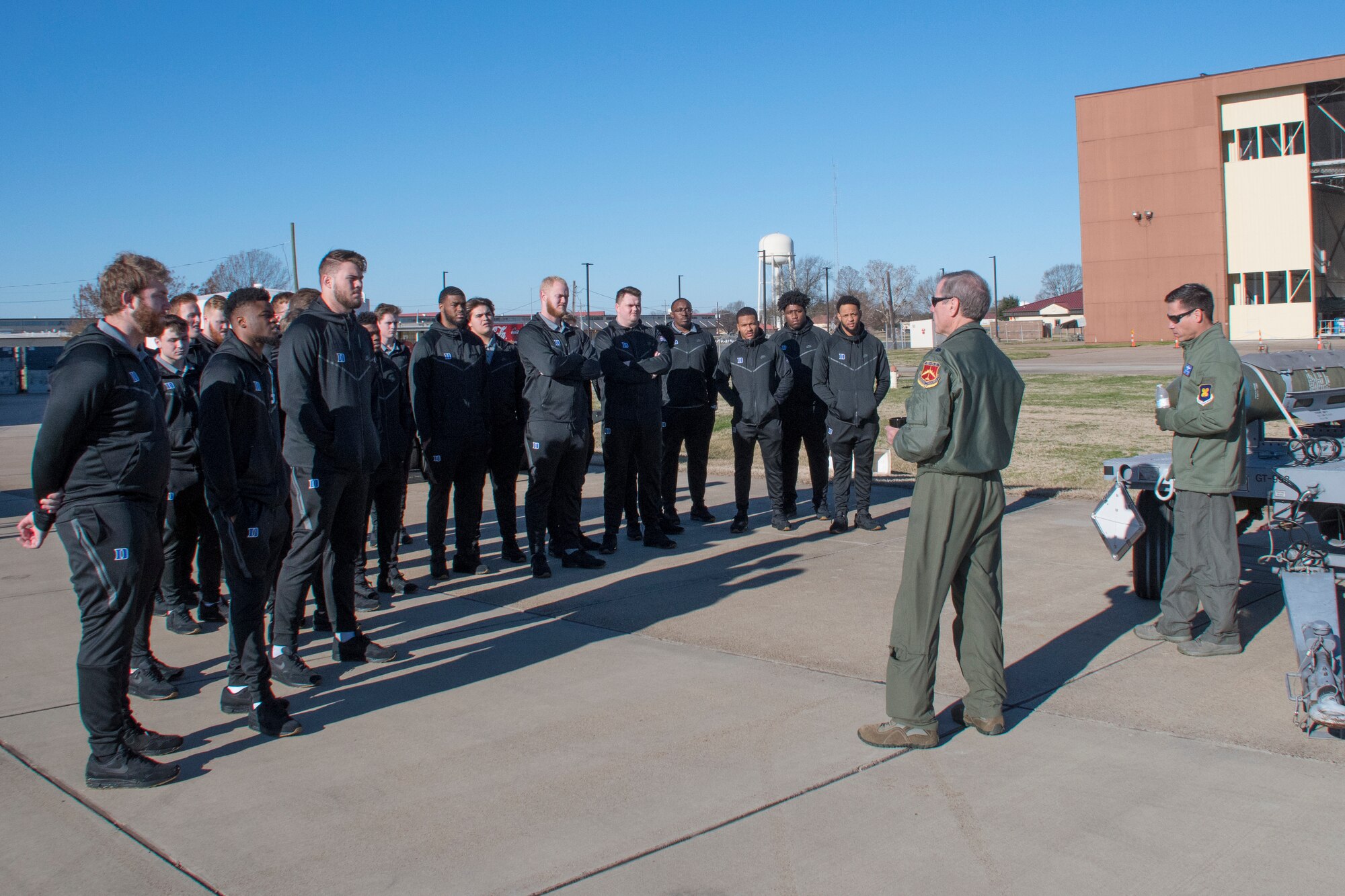 U.S. Air Force Lt. Col.Steven Smith, left, and Lt. Col.Christopher Chandler, both Reserve Citizen Airmen assigned to the 93rd Bomb Squadron, brief Duke University football players during their visit to Barksdale Air Force Base, Louisiana, December 24, 2018. Both the Duke and Temple University football teams visited Barksdale ahead of their matchup in the 2018 Walk On’s Independence Bowl. (U.S. Air Force photo by Master Sgt. Ted Daigle)