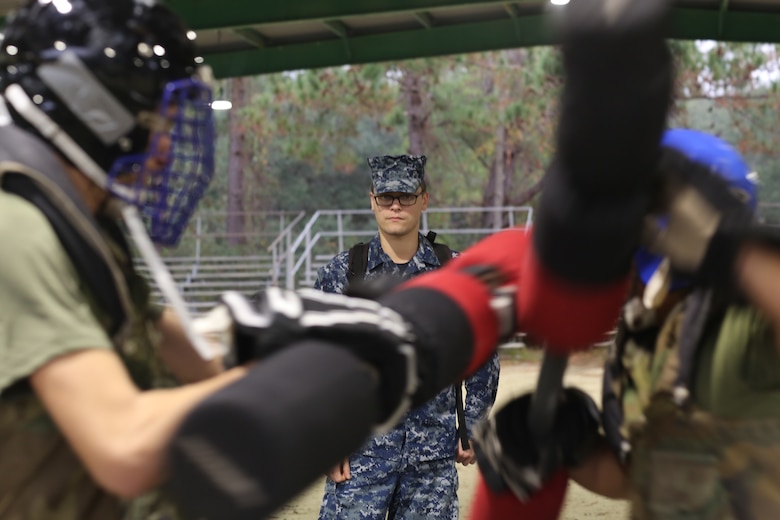 Seaman Joseph T. Frepan observes a recruit pugil stick match during the Crucible on Marine Corps Recruit Depot, Parris Island, Dec. 27, 2018.