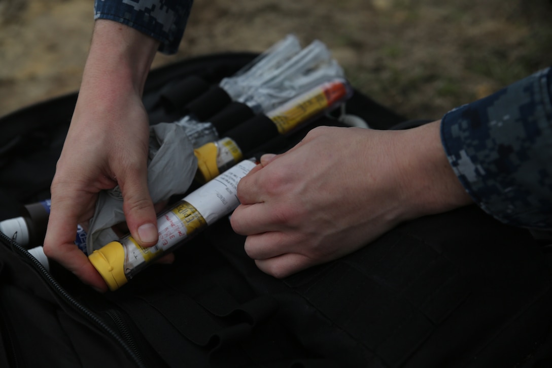 Seaman Joseph T. Frepan places medical supplies in his field bag during the Crucible on Marine Corps Recruit Depot, Parris Island, Dec. 27, 2018.