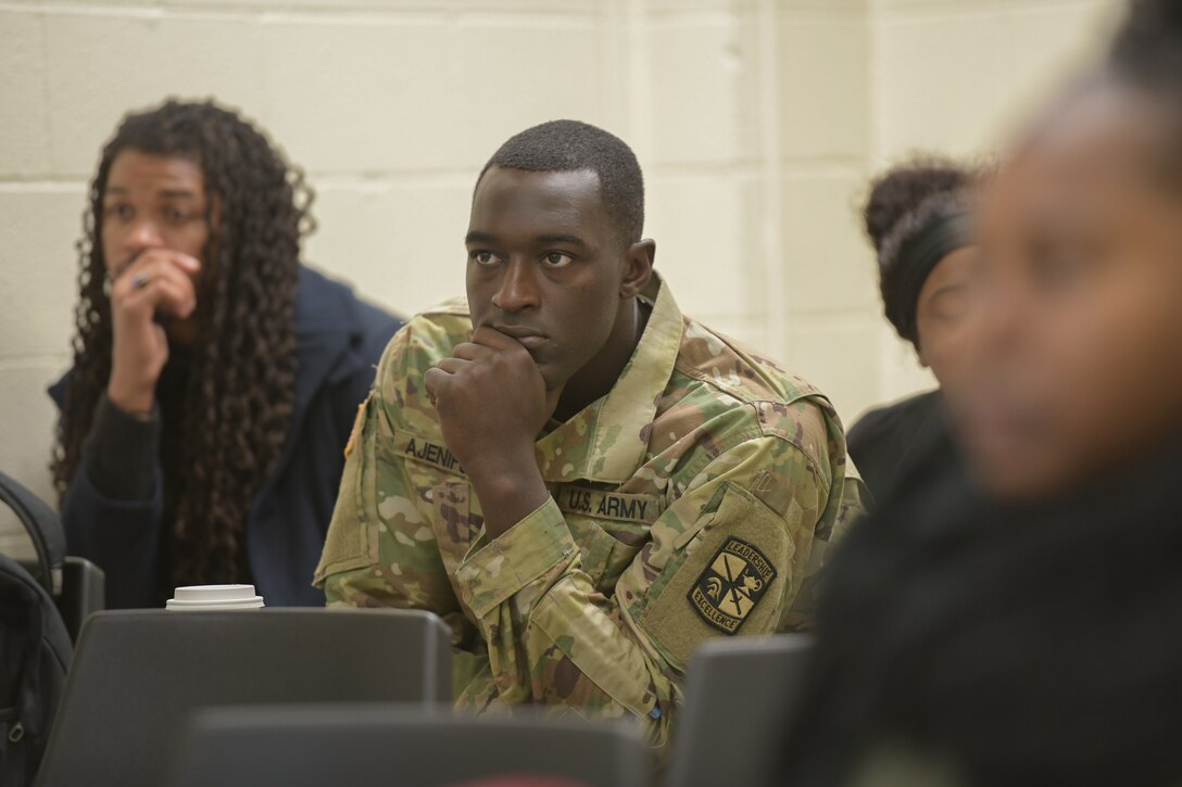 A man in an Army uniform attends a college class