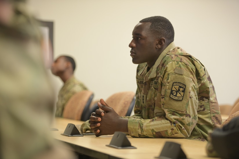 A man in an Army uniform attends a college class