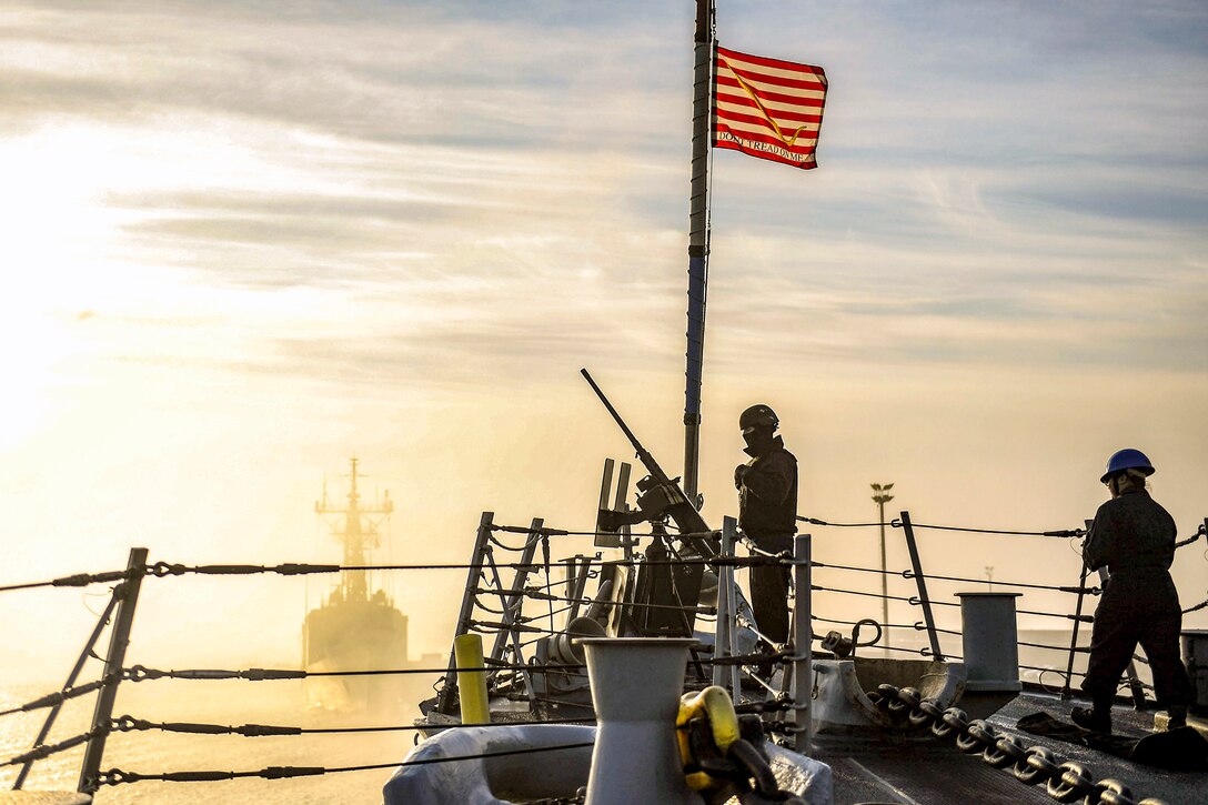 Sailors prepare to set sail.