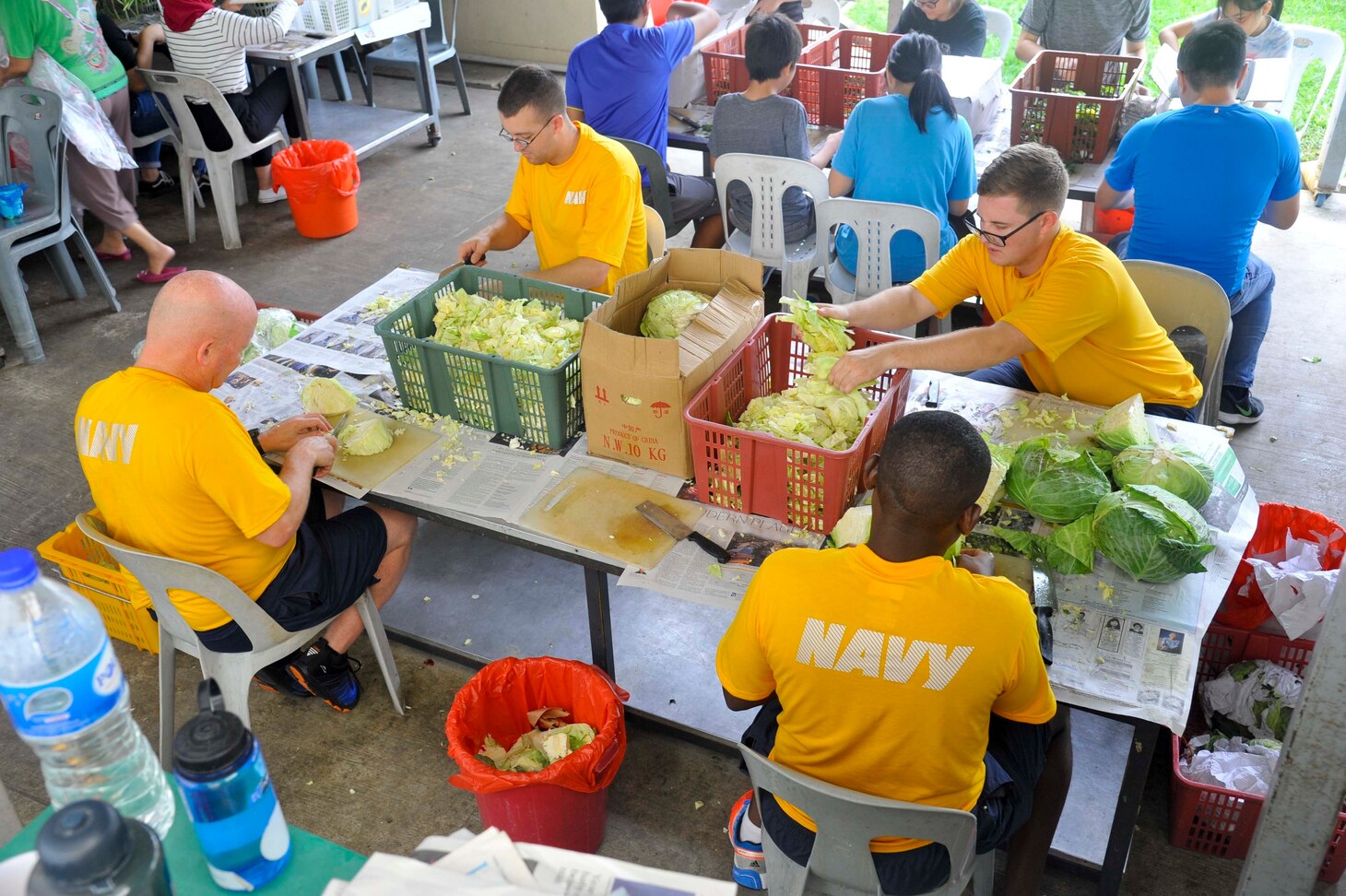 SINGAPORE (Dec. 20, 2018) – Sailors assigned to the submarine tender USS Emory S. Land (AS 39) cut cabbage during a community service event at the Willing Hearts Soup Kitchen in Singapore, Dec. 20. Emory S. Land is a forward-deployed expeditionary submarine tender on an extended deployment conducting coordinated tended moorings and afloat maintenance in the U.S. 5th and 7th Fleet areas of operations.