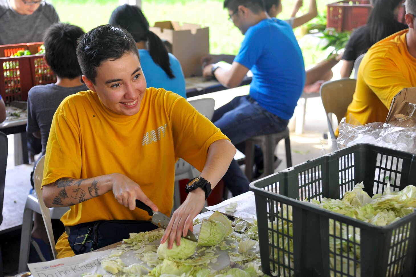 SINGAPORE (Dec. 20, 2018) – Machinery Repairman 3rd Class Alexis Rosales, a Sailor assigned to the submarine tender USS Emory S. Land (AS 39), prepares cabbage during a community service event at the Willing Hearts Soup Kitchen in Singapore, Dec. 20. Emory S. Land is a forward-deployed expeditionary submarine tender on an extended deployment conducting coordinated tended moorings and afloat maintenance in the U.S. 5th and 7th Fleet areas of operations.
