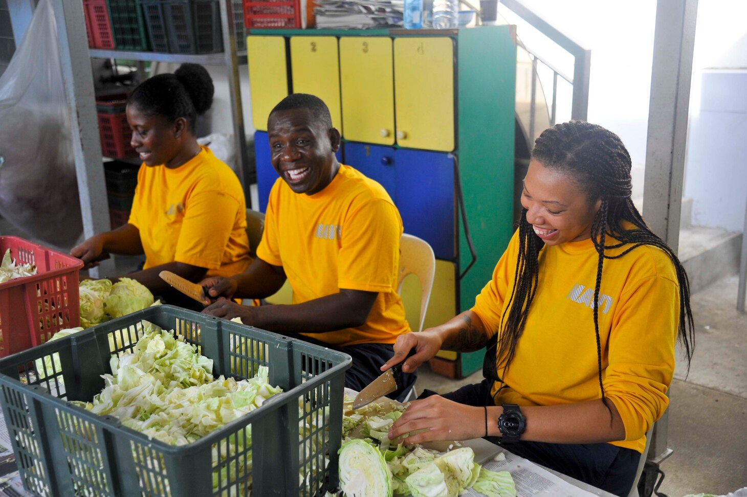 SINGAPORE (Dec. 20, 2018) – Sailors assigned to the submarine tender USS Emory S. Land (AS 39) cut cabbage during a community service event at the Willing Hearts Soup Kitchen in Singapore, Dec. 20. Emory S. Land is a forward-deployed expeditionary submarine tender on an extended deployment conducting coordinated tended moorings and afloat maintenance in the U.S. 5th and 7th Fleet areas of operations.