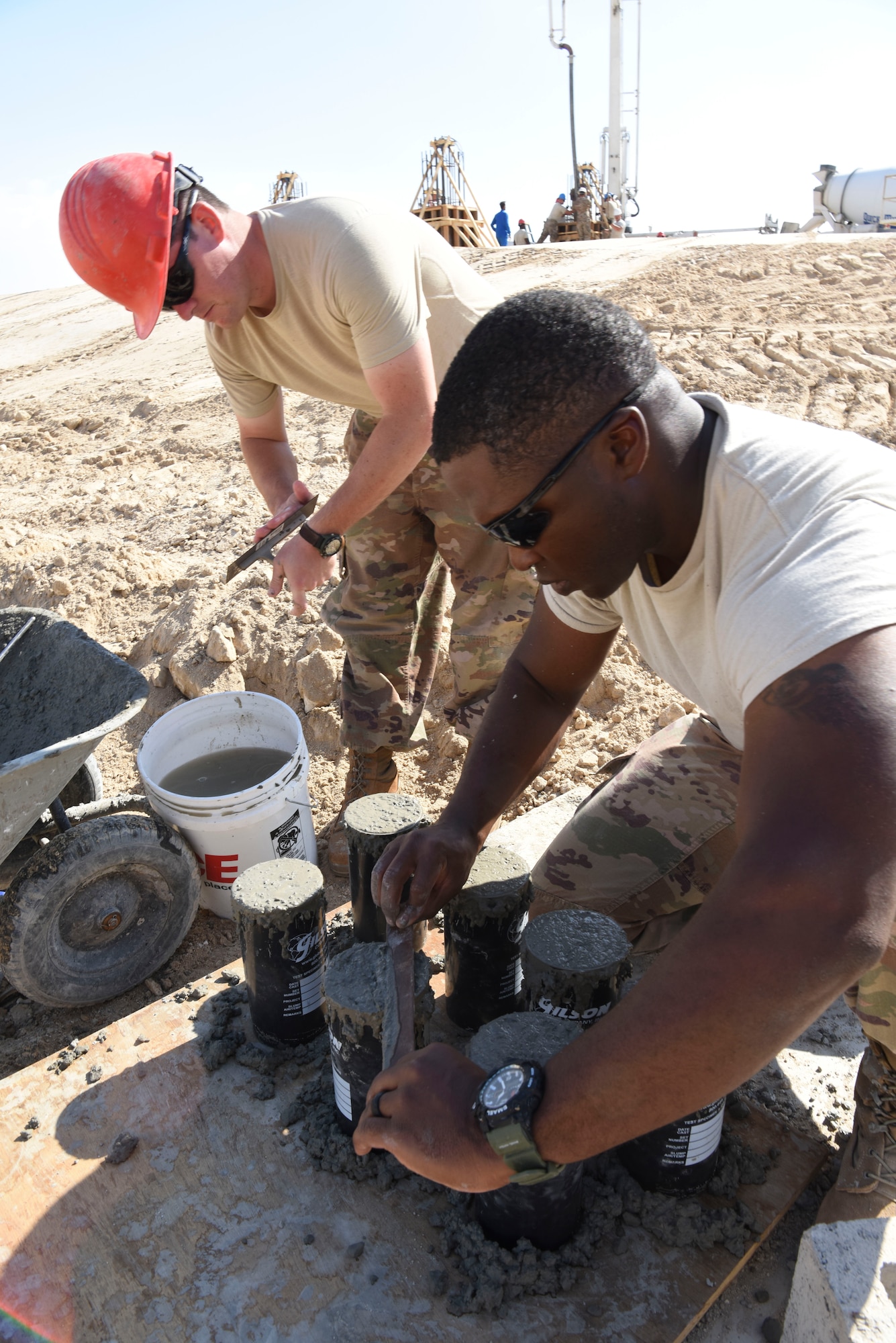 Tech. Sgt. Jeremy Goss, and Master Sgt. David Bigesby, 577th Expeditionary Prime Base Engineer Emergency Force engineering assistants, performs concrete testing during construction, Dec. 23, 2018 at Al Dhafra Air Base, United Arab Emirates.