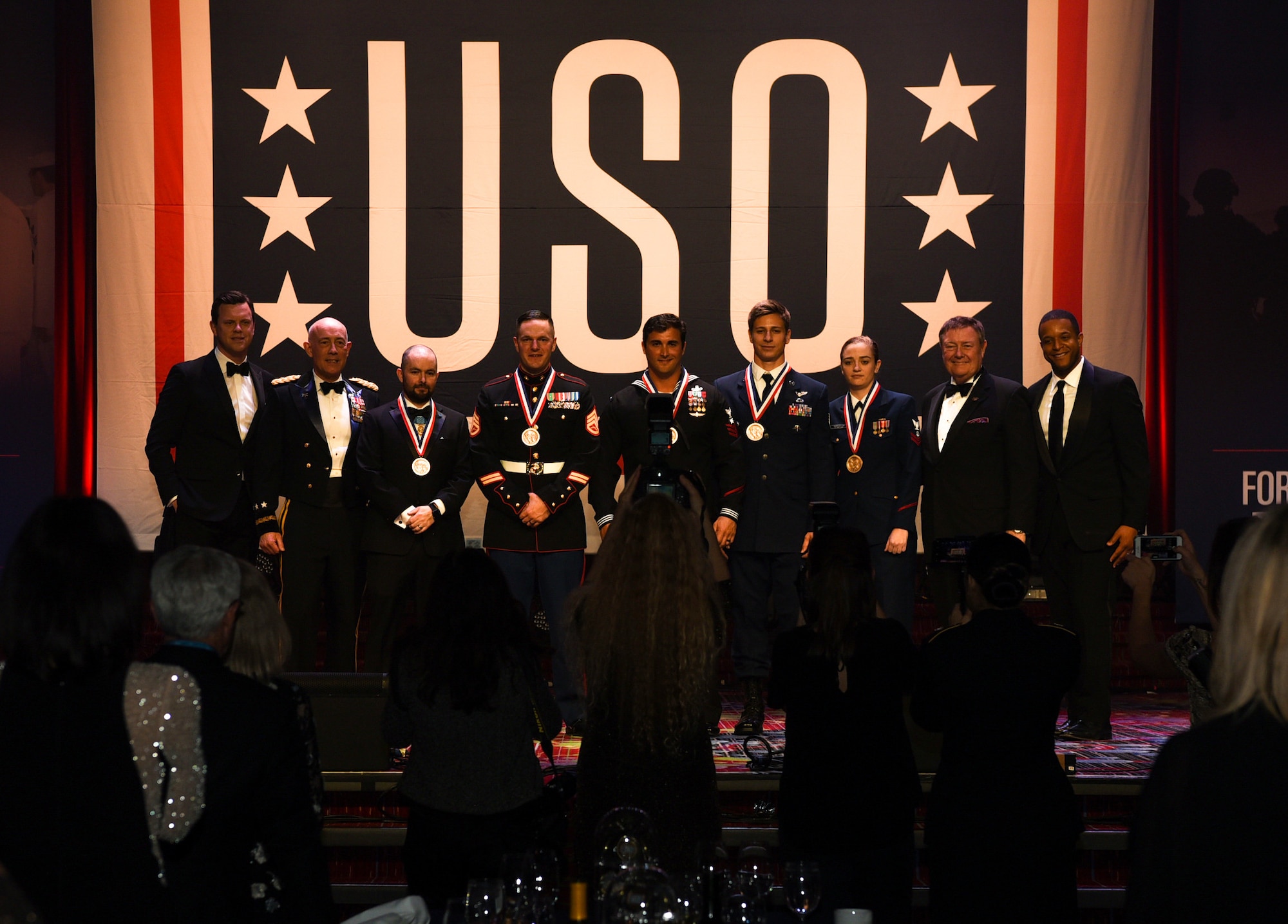 U.S. military members pose for pictures during the 57th Annual USO Armed Forces Gala at the New York Marriott Marquis in New York City, Dec. 12, 2018. Five service members were awarded a medal by the USO for risking their lives to help others in deadly situations. (U.S. Air Force photo by Airman 1st Class Ariel Owings)