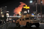 Nevada National Guard Soldiers provide security support to local law enforcement on the Las Vegas Strip as fireworks shoot from the rooftops of hotels during the 2018 New Year’s celebration.