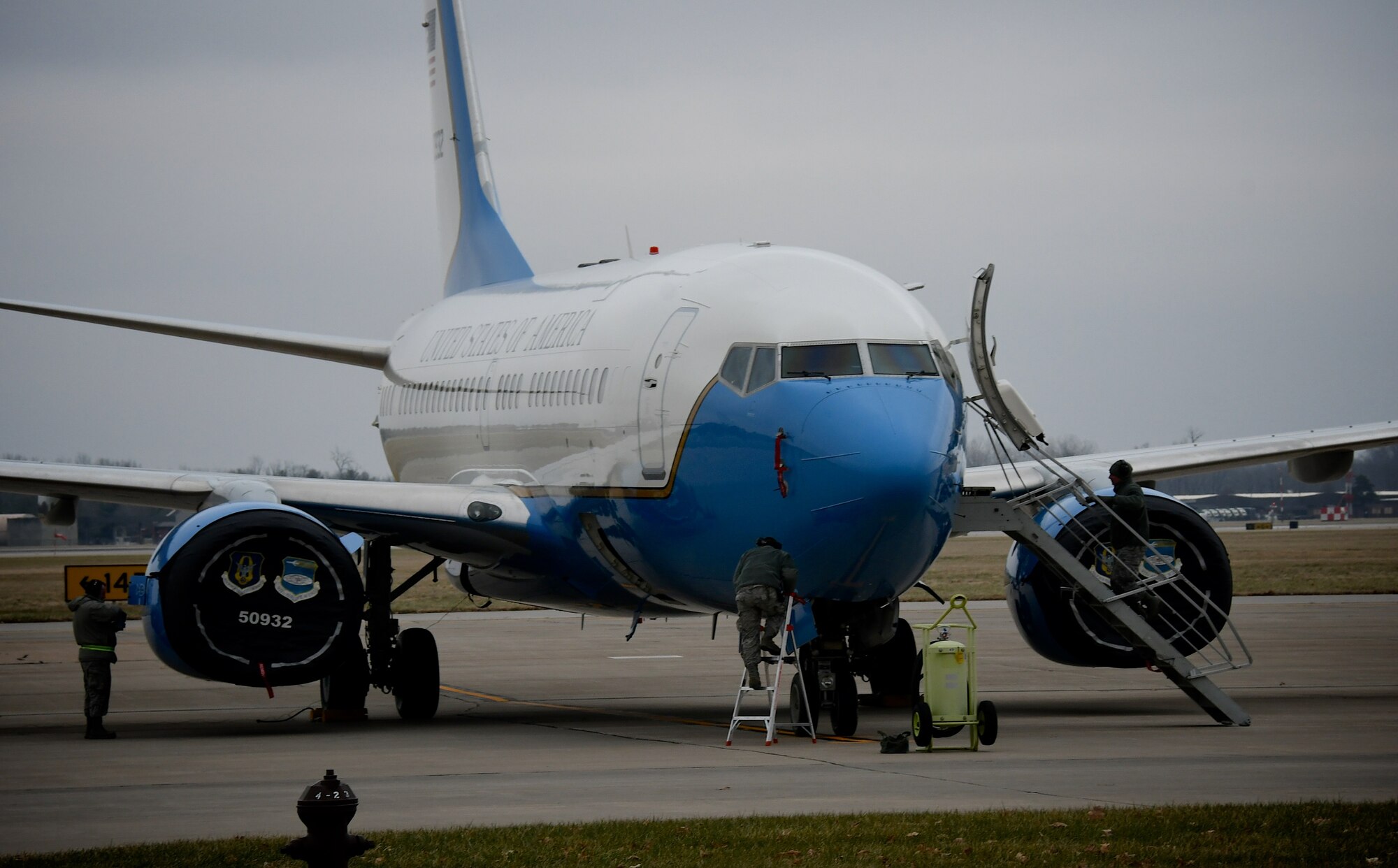 932nd Maintenance Group Airmen move in to position to complete post-mission aircraft checks on a C-40 plane following its return to Scott Air Force Base, Illinois, on Dec. 21, 2018.  Maintainers are constantly executing their mission: The 932nd Airlift Wing's Maintenance Group (MXG), is responsible for leading people who are always training and equipping to inspect, maintain and repair Air Force Reserve Command C-40C planes at Scott Air Force Base. The 932nd MXG's management of resources improves the wing's professionalism and enables the 932nd Operations Group's C-40C pilots to fly distinguished visitor (DV) airlift around the world, anywhere they are needed by the nation's leaders.  The Illinois unit, which is part of 22nd Air Force, under Air Force Reserve Command, flies four of the C-40C planes worldwide. (U.S. Air Force photo by Lt. Col. Stan Paregien)