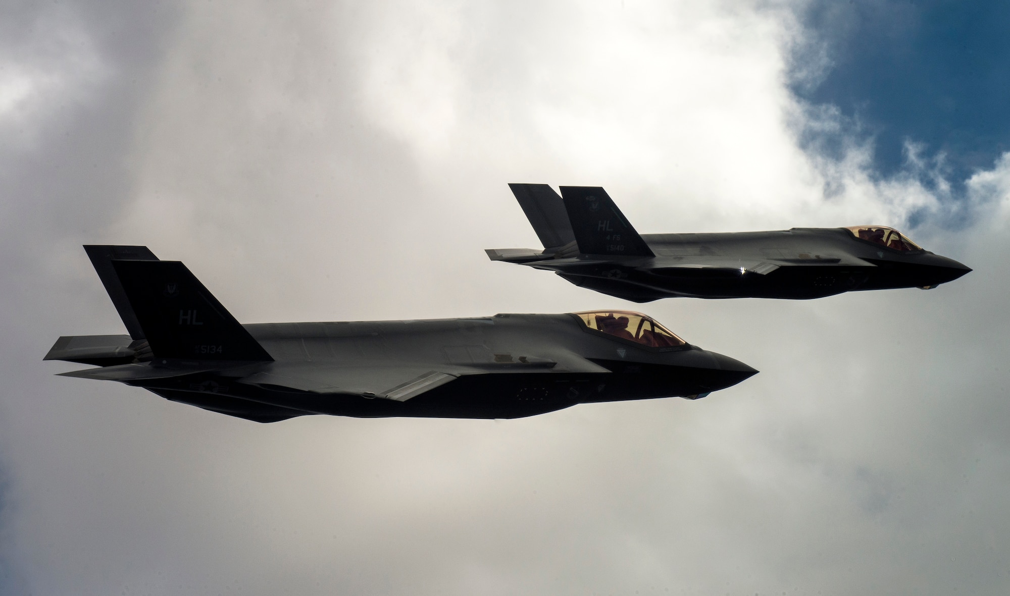 Two U.S. Air Force F-35A Lightning IIs fly over Hill Air Force Base and the surrounding area