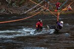 West Virginia Swift Water Rescue Team (SWRT) rescues a total of 12 victims over the course of three hours in a Vigilant Guard Massachusetts swift water training exercise Nov. 7, 2018. West Virginia SWRT uses a highline, rope rescue throw bags, and dib boats to save multiple swimmers coming down stream and victims from across the Deerfield River.