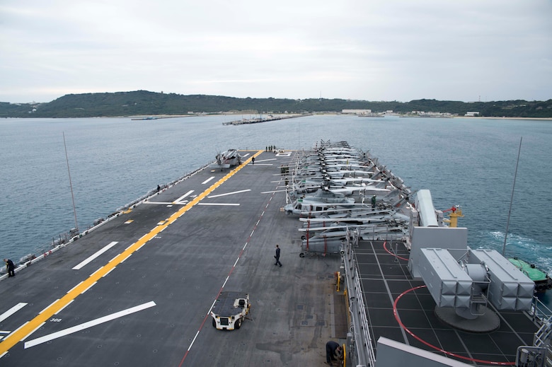 The amphibious assault ship USS Bonhomme Richard (LHD 6) approaches the pier at White Beach Naval Facility. During the visit, the ship will embark 3d Marine Division personnel, vehicles and equipment, prior to continuing a scheduled patrol.