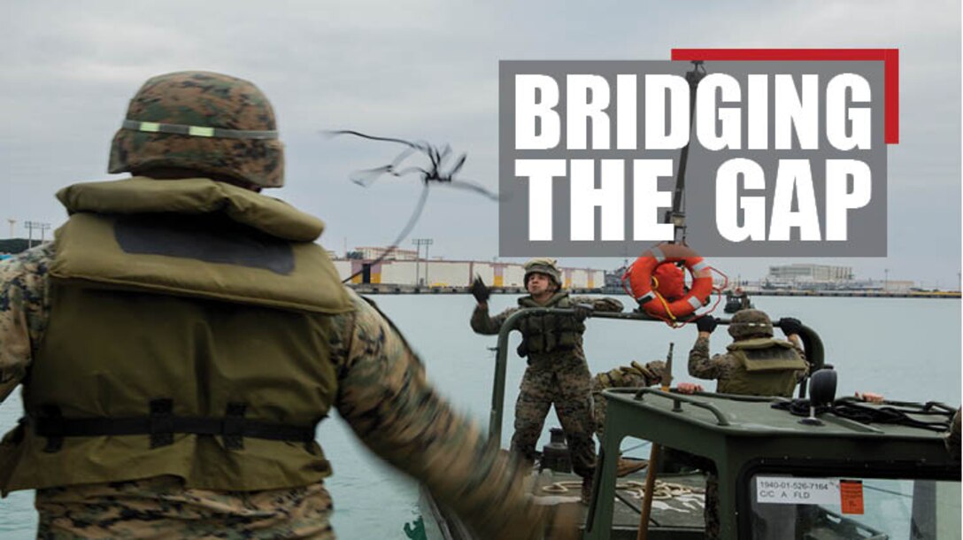 Lance Cpl. Andrew Hollom (left), a combat engineer with Bridge Company, 9th Engineer Support Battalion, Combat Logistics Regiment 35, throws a rope to Lance Cpl. Alex Hisey, also a combat engineer with Bridge Co., to secure the Bridge Erection Boat to an Improved Ribbon Bridge (IRB) bay at Naha Military Port, Okinawa, Japan Jan. 31, 2018. Bridge Co. conducted training with IRBs to train new Marines and to show the capabilities of the newly-formed company. Hollom is a native of Poplar, Montana. Hisey is a native of Toledo, Ohio. (U.S. Marine Corps photo by Lance Cpl. Jamin M. Powell)