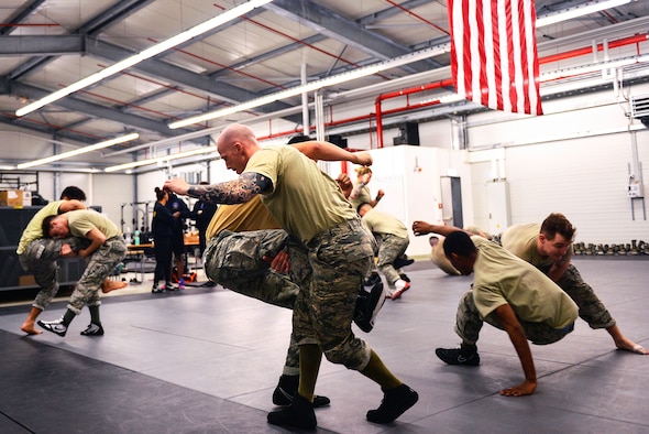 Participants in the Phoenix Raven Qualification Course practice combatives on Ramstein Air Base, Germany, Jan. 29, 2018. Raven instructors assigned to the 421st Combat Training Squadron at Joint Base McGuire-Dix-Lakehurst, New Jersey, formed a mobile training team to conduct the course at Ramstein. (U.S. Air Force photo by Senior Airman Joshua Magbanua)