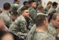 Airman listening to speaker