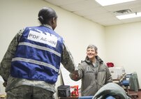 Airman shaking hands with Gen.  Pawlikowski