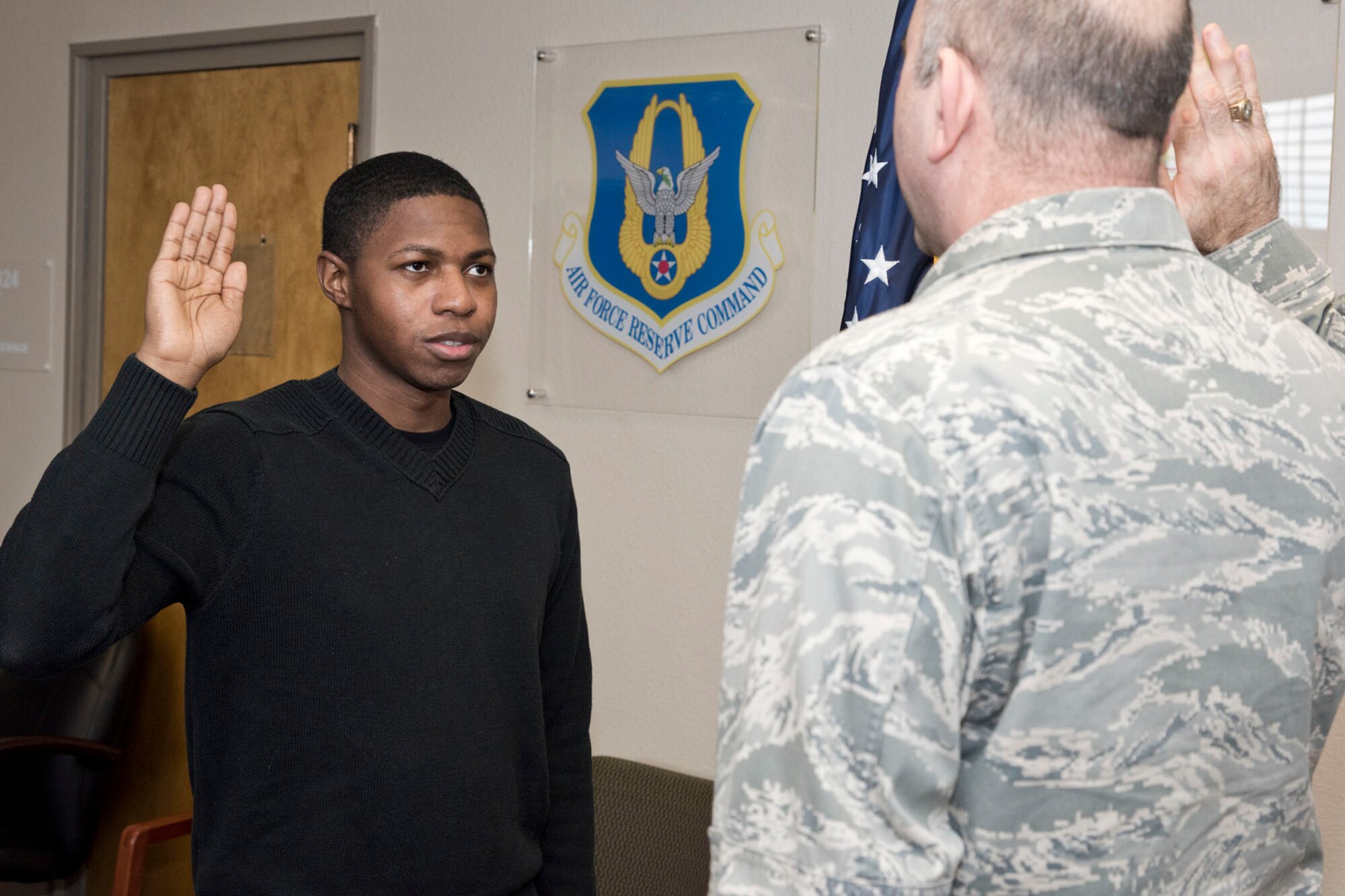 U.S. Air Force Reserve Senior Airman Derrick Barnes, a crew chief assigned to the 913th Maintenance Squadron, makes the commitment to continue serving his country by taking a re-enlistment oath administered by Lt. Col. Paul Centinaro, commander, 913 MXS, at Little Rock Air Force Base, Ark., Jan. 31, 2018. This is Barnes second enlistment six-year enlistment. (U.S. Air Force photo by Master Sgt. Jeff Walston/Released)